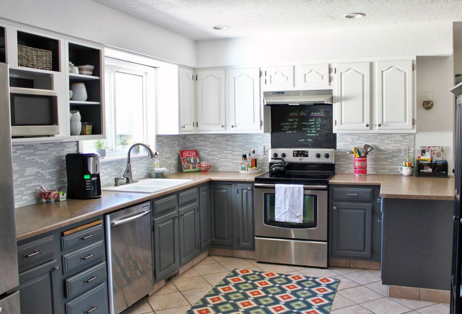 Grey Wood Kitchen Cabinets Design With Brown Granite and Black Appliances