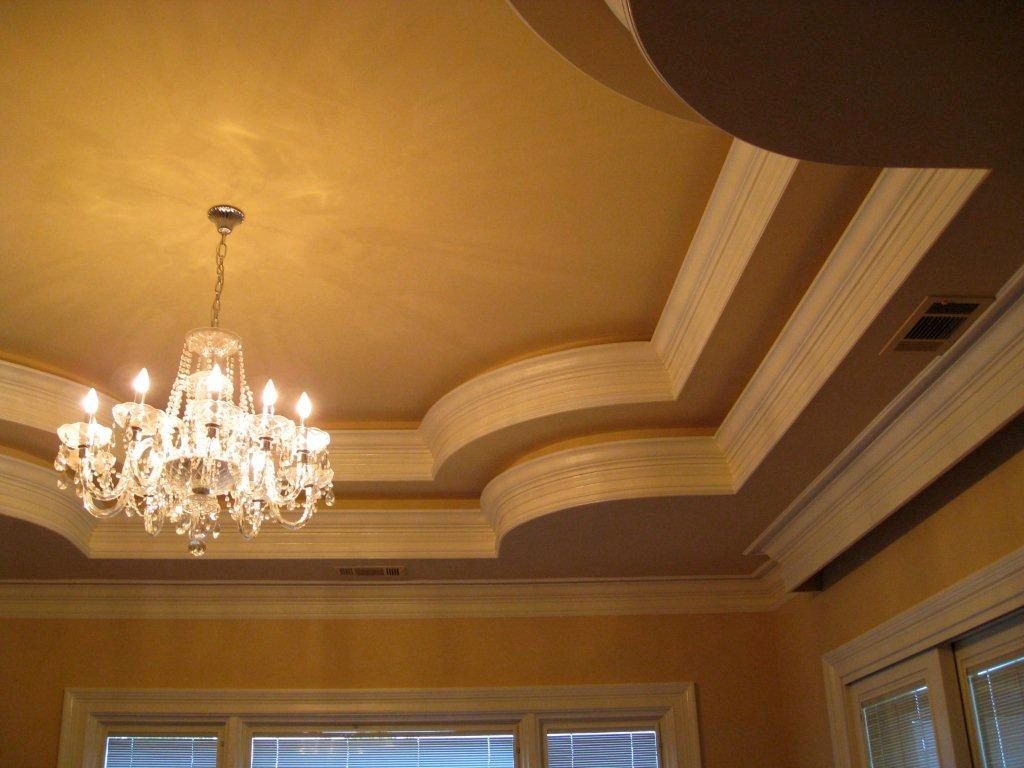 tray ceiling bedroom with spider chandelier