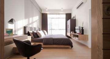 Brown and white bedroom with comfy small home office design