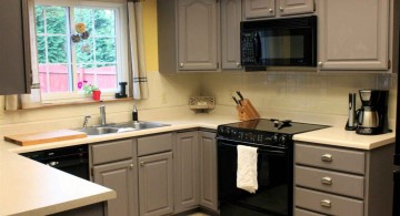 Grey painted kitchen cabinets in small kitchen space