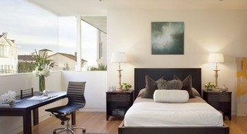 Neat home office in guest bedroom design with open view through large window