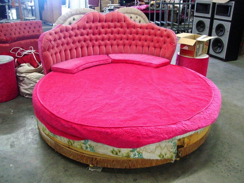 Romantic round bed with pink tufted bed board