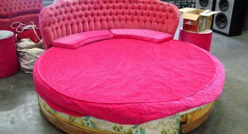 Romantic round bed with pink tufted bed board