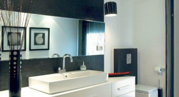 white vanity in stunning modern black and white bathroom interior