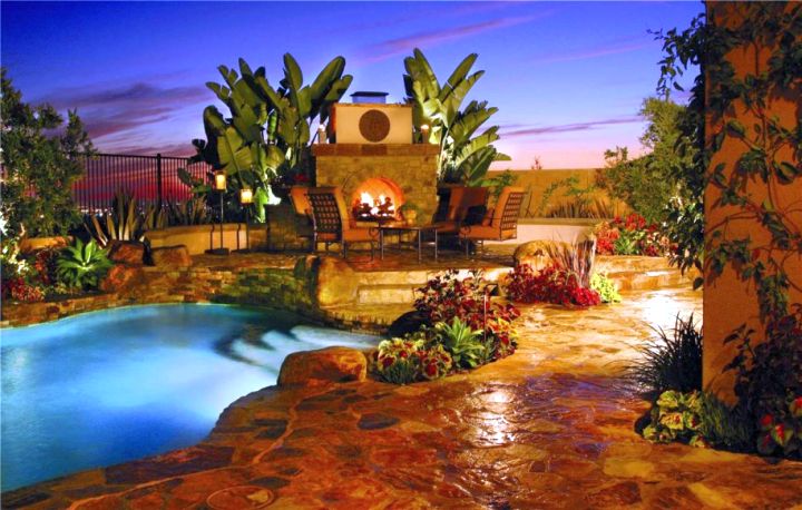 Backyard pool designs with fireplace