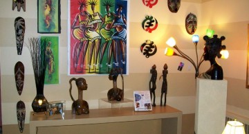 african living room decor with statuettes and masks