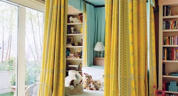 blue and gold bedroom with canopied bed for kids