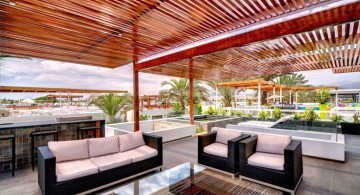 bright colored rooftop modern deck design with monochrome furnitures