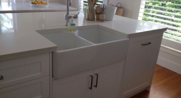 close up on simple kitchen island with sink