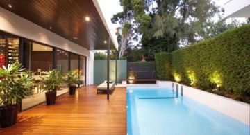 contemporary Backyard pool designs with wooden deck