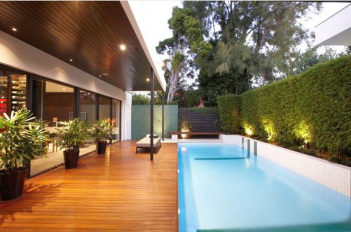 contemporary Backyard pool designs with wooden deck