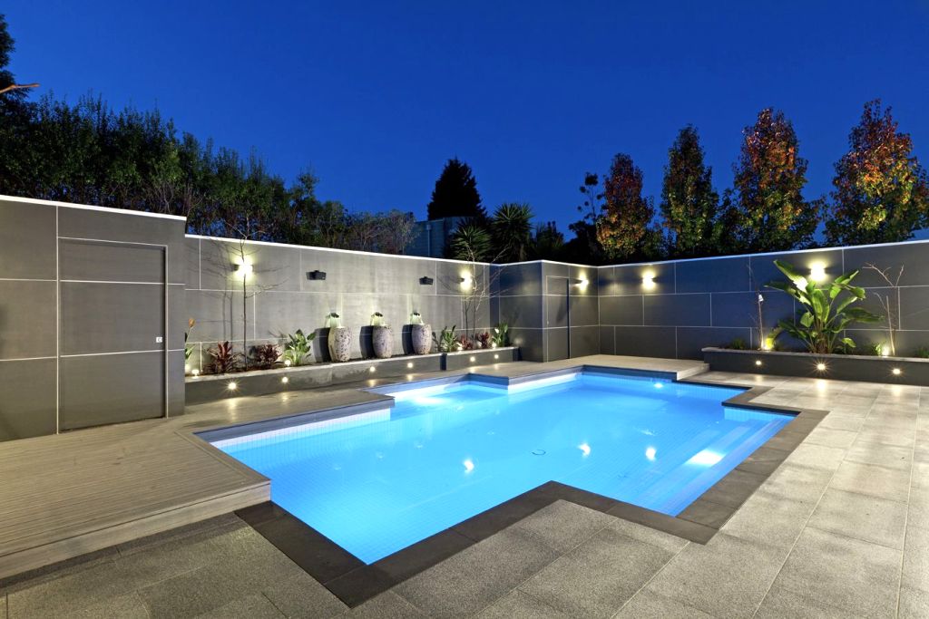 contemporary best backyard swimming pool designs in glamorous light.