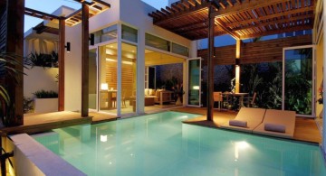 contemporary best backyard swimming pool designs with wood patio