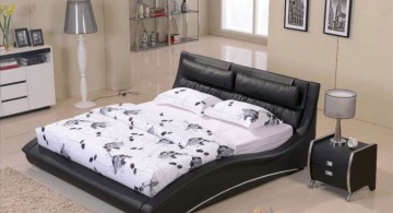 curved bed designs in black with white linen