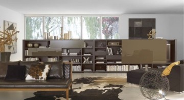 earth tone living room with low bookshelf as separator