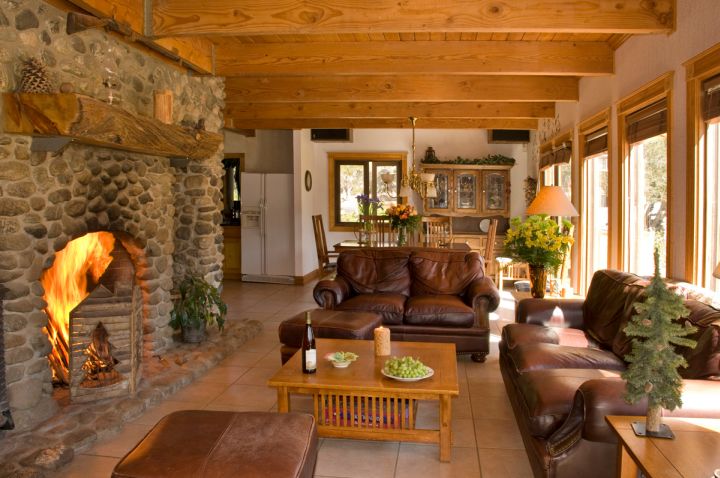 earth tone living room with stone fireplace