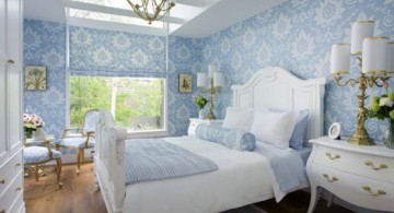 feminine blue and gold bedroom with blue wallpaper