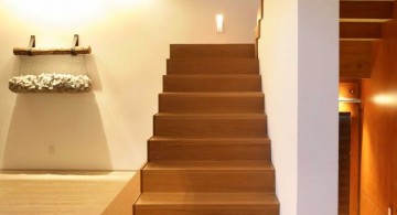 floating wooden stairs with wall railing