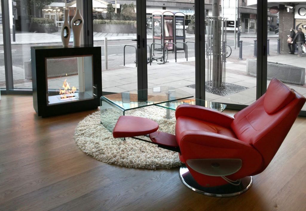 freestanding fireplaces designs with red reclined chair