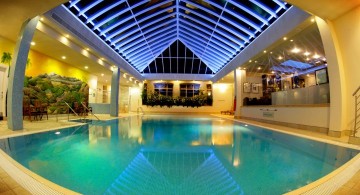 glamorous indoor swimming pool with wide skylight