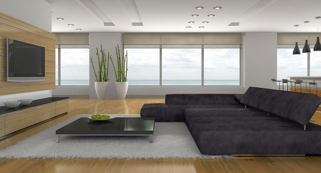 hang out room ideas with wide sofa in monochrome tone and wooden floor