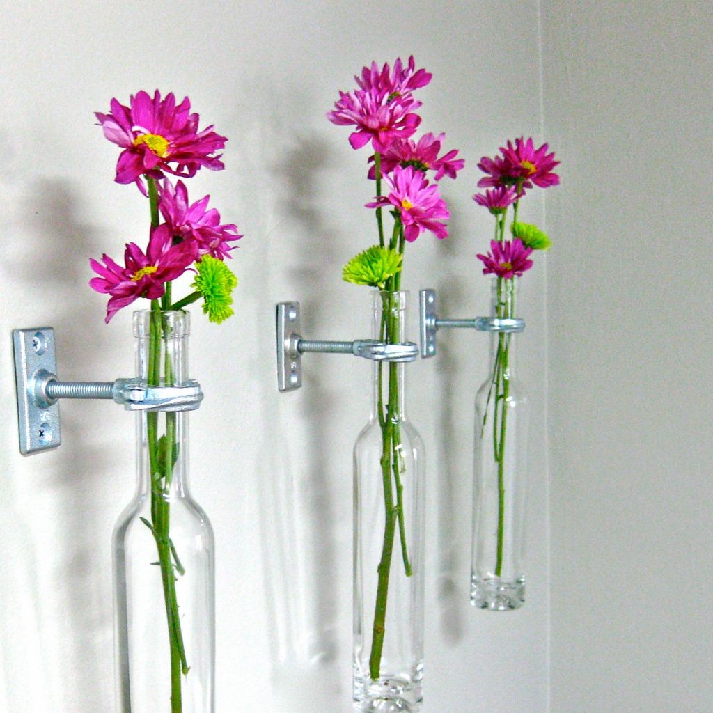hanging flower vase with old bottles