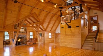 indoor home basketball courts with visible wooden beams