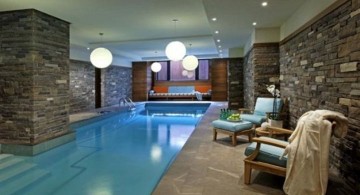 indoor swimming pool with stone wall