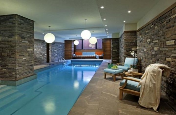 indoor swimming pool with stone wall