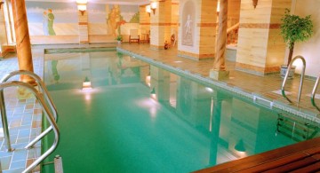 indoor swimming pool with wooden deck