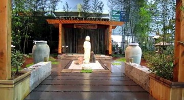 japanese style backyard with pergola and wooden pathway