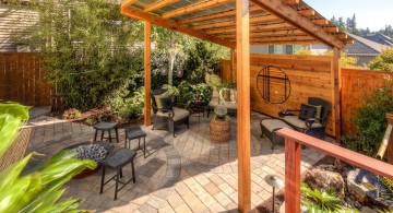 japanese style backyard with rustic pergola and bamboo fountain