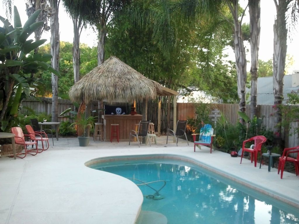 kidney shaped swimming pools with tiki hut