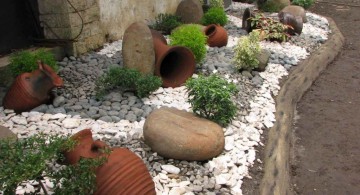 landscaping designs with big rocks and old jugs