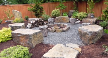 landscaping designs with big rocks and outdoor fireplace