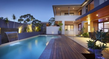 lap pool designs with dark wood deck