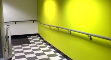 lime green accent walls for the hallway with black and white tile