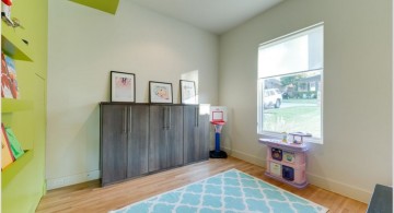 lime green accent walls with blue rug