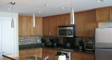 long and sleek mini pendant lights over kitchen island