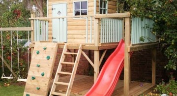 luxury outdoor playhouse with red slide and swings