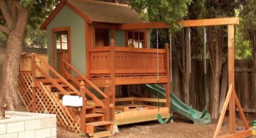 luxury outdoor playhouse with swing and slide