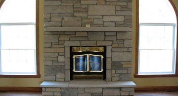 modern fireplace designs with glass in a brick wall