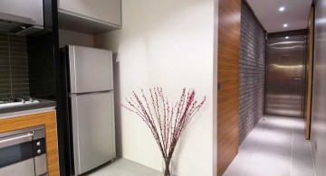 modern hallway decorating ideas with half wood and half brick wall
