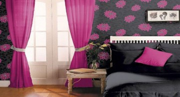 pink and black bedroom decor with black bed and pink curtains
