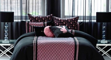 pink and black bedroom decor with playboy logos