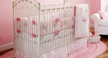 pink baby room ideas with simple accent on oval rug