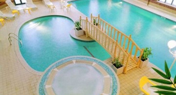 pool shapes and designs with bridge and seating area for indoor pools