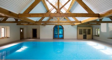 rustic indoor swimming pool with skylight