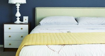 simple blue and gold bedroom with minimalist furniture