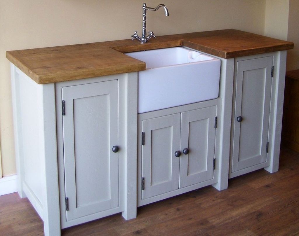 small kitchen sink and cabinet